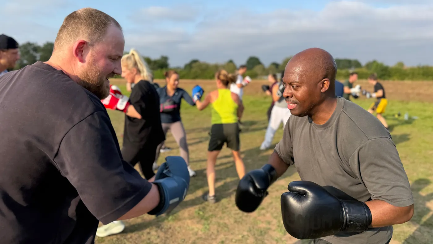 Boxing pad work during a Krank Unleashed session