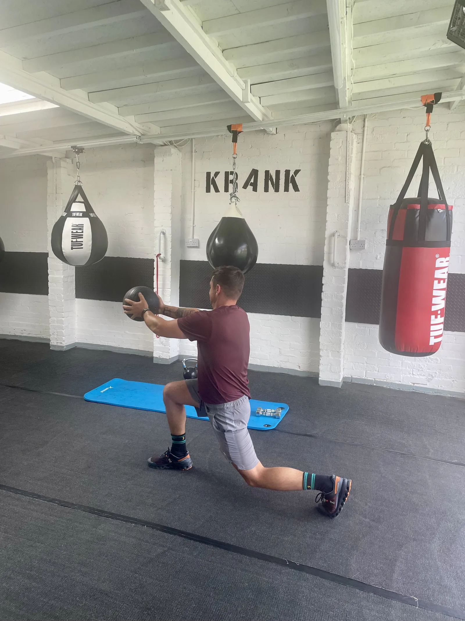 Craig performing strength and stability training during personal training at Krank Boxing and Fitness Durham